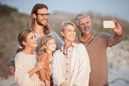 Beach, selfie and grandparents, parents and child by sea for bonding, relax and travel together in...