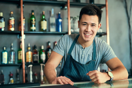 Happy, Asian and man as barista for portrait in restaurant, cafe and coffee shop for hospitality, food and fine dining industry. Smile, Korean and male person as owner, waiter and startup businessの写真素材