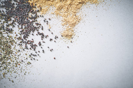 Black pepper, seasoning and spices by white background for ingredients, herbs and aroma for sensory appeal. Mockup space, seeds and flavor for cooking with condiment, peppercorn and dry in studioの写真素材