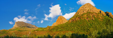 Mountain, moss and clouds in sky in nature by journey for travel destination in Norway. Environment,...