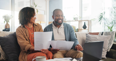 Home, documents and senior couple with laptop, conversation and financial planning. Apartment, man...
