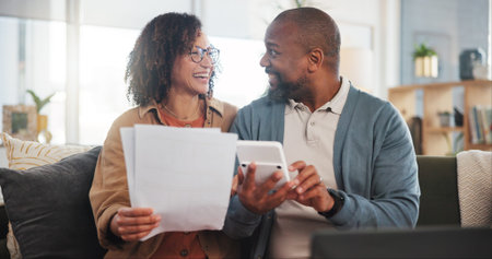 Savings, documents and old couple with laptop, calculator and financial planning. House, happy man and woman with paperwork, budget and retirement fund with investment, connection and pc in loungeの写真素材