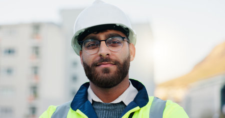 Construction worker, rooftop and portrait of man with architecture and urban planning with confidence outdoor. Architect, civil engineering and job in city with quality assurance work in Brazilの写真素材