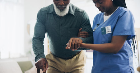 Nurse, senior man and holding hands with cane for walking, care and guide for recovery from injury in retirement. Black people, support and elderly person with disability, caregiver or rehabilitationの写真素材