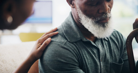 Nurse, hand and senior patient with cane for elderly care, grief or empathy in trust or support at retirement home. Closeup, healthcare employee or caregiver with male person for comfort or sympathyの写真素材