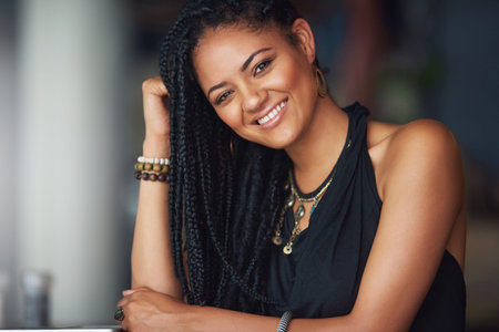 African woman, remote work and portrait in cafe with smile, confidence or design career in Tanzania....