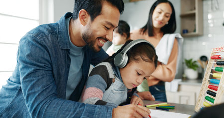 Parents, children and writing with headphones for elearning, distance learning or virtual class in kitchen at home. Mother, father and kids or siblings for help, online lesson or homework at houseの写真素材