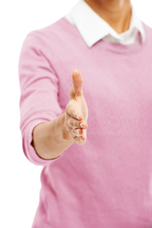 Woman, studio and hand of employee with greeting for partnership, deal and agreement on white background. Female person, business and retail store manager with welcome and thank you for serviceの写真素材