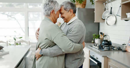 Senior couple, dance and hug in house for love, care and romantic connection with marriage commitment. Elderly people, smile and embrace in home for support, bonding and relationship with loyaltyの写真素材