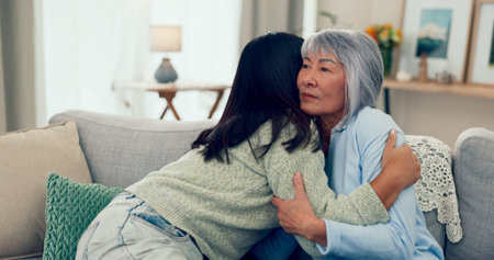 Love, hug and mother with adult daughter, affection and bonding together in living room. Apartment,...