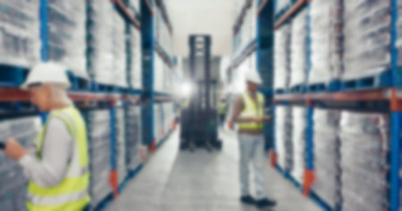 Blur, warehouse and employee with logistics, cargo and supply chain with storage facility. People,...
