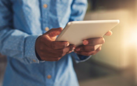 Hands, business and person with tablet in office for project research, communication and financial report of growth. Employee, digital and reading email, kpi information and networking for progressの写真素材