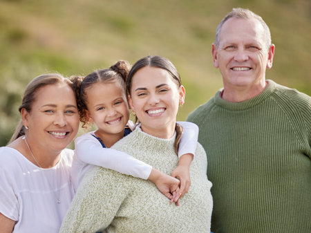 Portrait of grandparents, mom and child in park for bonding, relationship and relax together. Happy...