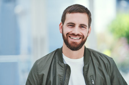 Man, portrait and happy in office for small business, creative industry or job opportunity. Designer, smile and face in workplace for creativity, startup development or career growth in New York cityの写真素材