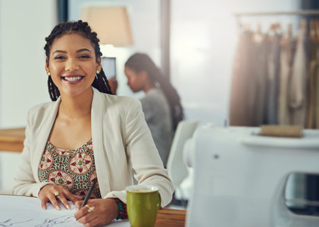 Happy woman, portrait and fashion designer with sketchbook for clothing, drawing or planning at boutique. Young, female person or dressmaker and seamstress with smile for outfit design at workshopの写真素材