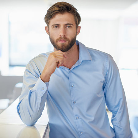 Business man, office and portrait with professional and confidence with public relations worker. Serious staff, advisor company and about us at startup with agent and employee at consulting agencyの写真素材