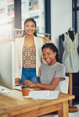 Employees, computer and portrait for fashion, clothes business and website to upload stock. Women, partnership and online trade for production, style project and email clients with order serviceの写真素材