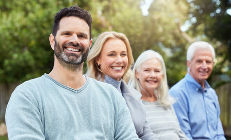 Mature man, smile and family in garden on break, relax and bonding for wellness in morning. Couple,...