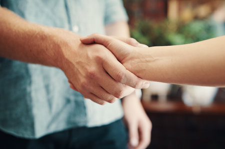 Creative, people and handshake with meeting success for florist partnership, supplier deal or hiring employee. Small business, shaking hands and welcome to flower shop with onboarding and thank youの写真素材