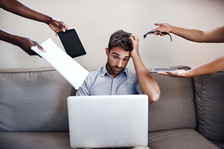Business, man and hands with stress for deadline on sofa with time management fail, overwhelmed or multitasking. Entrepreneur, freelancer and headache with reminder, tasks and laptop with remote workの写真素材