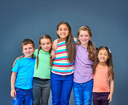 Hug, happy and portrait of children on blue background for back to school, education and academy....