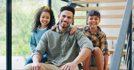 Father, children and portrait on stairs in new house with property investment, real estate and security. Family, people and happy kids on staircase of dream home for insurance, mortgage and supportの写真素材