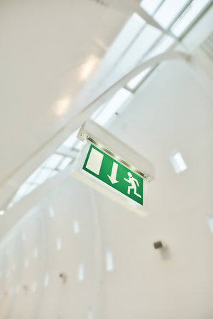 Airport, wallpaper and exit sign, background and texture with corridor, travel or building. Below,...