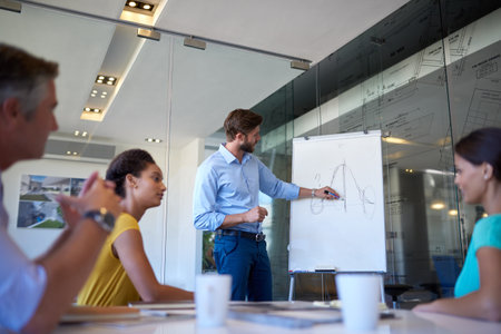 Business, man and whiteboard presentation in office for information, proposal planning or ideas of project. Speaker, people and meeting for financial growth, investment and feedback solution of pitchの写真素材