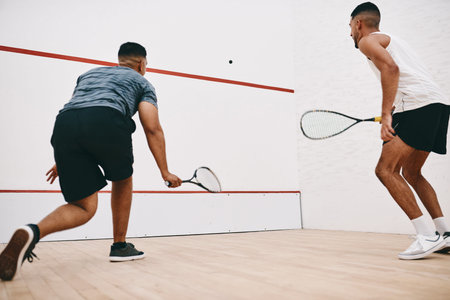 Sports, men and play squash for game, exercise and athlete training together for fitness. Racket,...