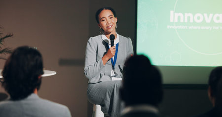 Woman, stage and happy at conference for innovation and future discussion as public speaker. Female...