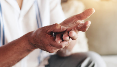 Hands, senior man and arthritis or pain at nursing home for retirement, support and help. Male...