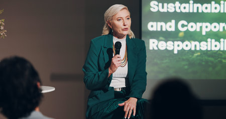 Mature woman, stage and sustainability at seminar for information, knowledge and public speaking....