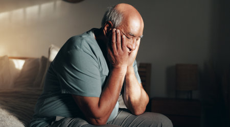 Retirement, thinking and old man in home, illness and depression in morning, stress and mental health. House, sick and fear of disease, sad and anxiety for alzheimer, contemplating and senior personの写真素材