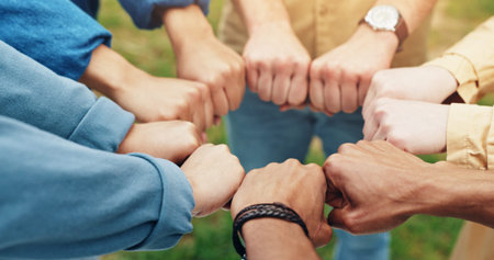 Hands, fist and students with teamwork outdoor for education support, learning success and studying....