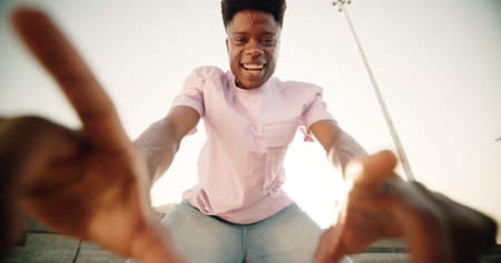 Black man, selfie and happy in city, portrait and outdoor with pointing, excited and live streaming on web. Person, influencer and photography for video, post and social network in street in Nigeriaの写真素材