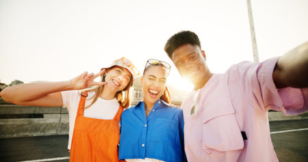 City, style and group of people with selfie, diversity and cool streetwear on bridge at sunset....