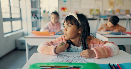 Girl, child and drawing in classroom with coloring, paper and art with butterfly, scholarship and...