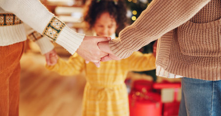Christmas, closeup and prayer with family holding hands for festive, worship and xmas celebration....