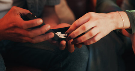 Drug, addiction and hands of people with pills for illegal, narcotics and problem with substance...