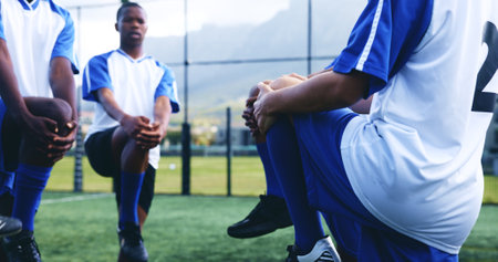 Legs, men and stretching with fitness on soccer field for sports game, exercise and warm up challenge. Team, people and prepare with football competition, workout performance and tournament trainingの写真素材