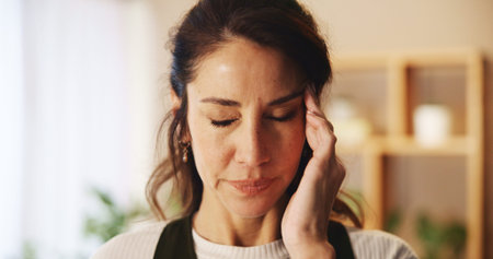 Home, woman and pain with headache for burnout, overthinking and fatigue for freelance deadline....
