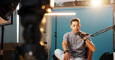 Audio, podcast and man in studio, host and live streaming with influencer, equipment and content...
