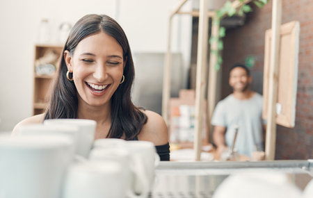 Cafe, small business and woman with coffee machine for drink, espresso and matcha latte for preparation. Restaurant, female person and barista with laughing for joke, customer service and hospitalityの写真素材