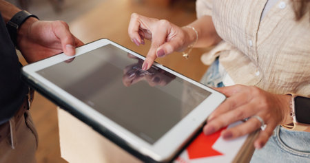 Hands, delivery man and woman with tablet screen, signature and package with service. Tech, home and people with connection, shipping or logistics with digital app, ecommerce or internet with closeupの写真素材
