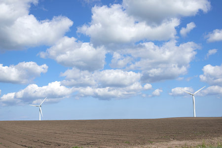 Clouds, landscape and sky with wind turbine for renewable energy outdoor to produce electricity....