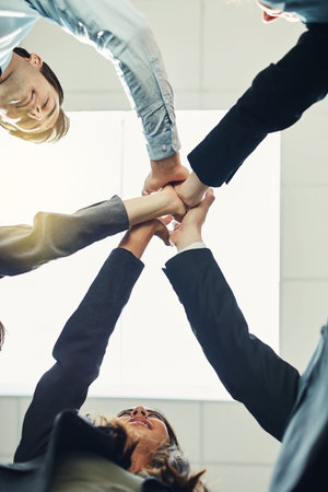 Below, hands and together for teamwork or huddle in synergy, office and collaboration for project....