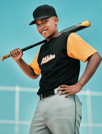 Sport, baseball player and portrait with bat on field for match exercise, competition workout and smile on pitch. Teenager, boy athlete or fitness for game performance, training or softball challengeの写真素材