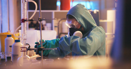Drugs, person and gas mask in lab for production of illegal substances, narcotics or crystal meth....