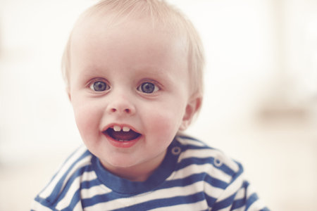 Baby, happiness and child development in home for growth, motor skills and milk teeth as healthy...