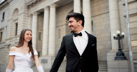 City, building and couple at wedding with smile, walking and bride with groom in street together....